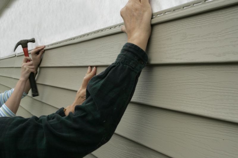Installing siding panels on a home